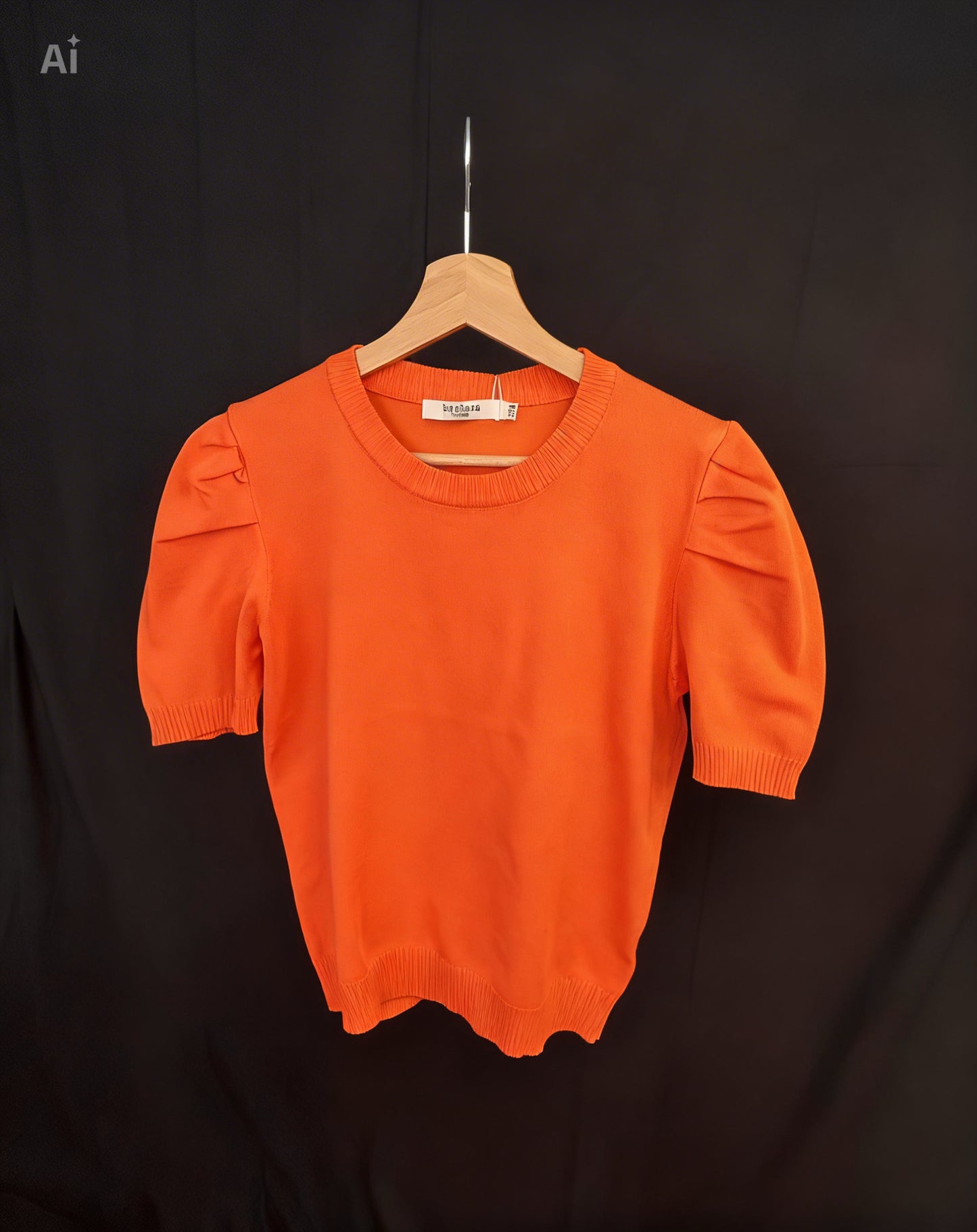 Pull léger orange à manches bouffantes